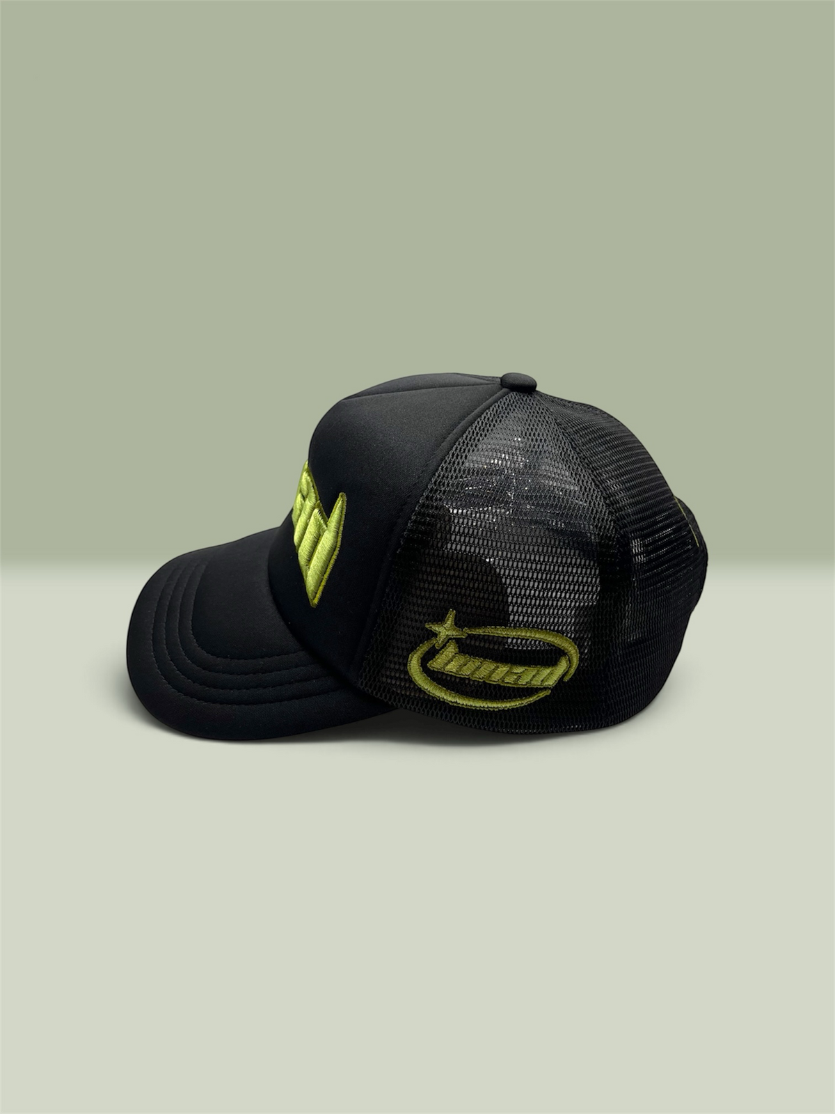 Black LUNAD trucker with sage green LUNAD original logo on side and front panel 